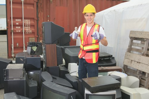 Photograph showing office clearance team preparing to remove furniture safely