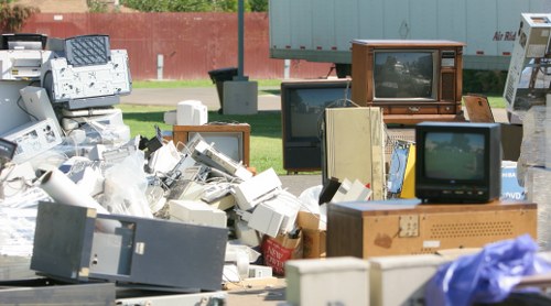 Photo of an inspector checking vehicle load security before rubbish removal